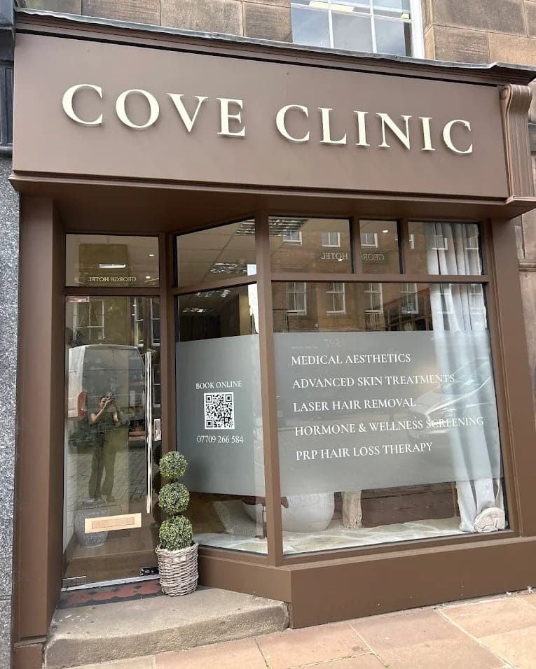 The front of Cove Clinic on Devonshire Street, a brown shopfront with the name in gold lettering